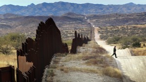 An illegal migrant crosses the border between Mexico and the US. Click to enlarge