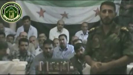 Still from video of captive Iranian pilgrims.