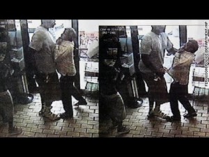 Still from CCTV footage of Michael Brown threatening store owner. Click to enlarge, video linked below