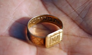 A golden ring inscribed in Hebrew which was unearthed by archaeologists at Sobibor. Photograph: Kacper Pempel/Reuters. Click to enlarge