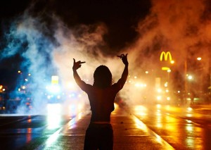 Demonstrators defy curfew in Ferguson. Click to enlarge