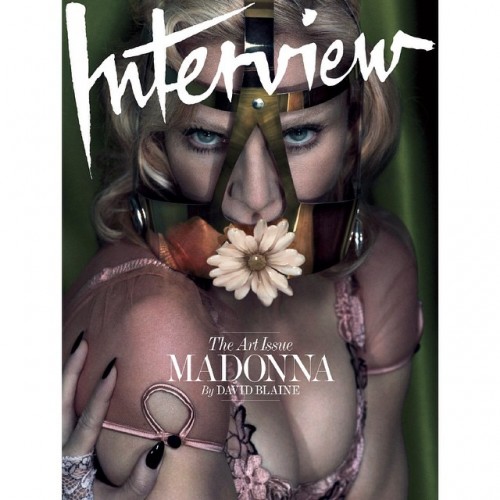 Speaking of Madonna, here she is on the cover of Interview with what looks like a Masonic compass on her face. She is completely silenced by the mask – like a true puppet.