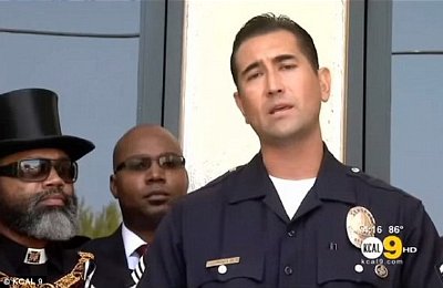 Henry and Kiel pictured alongside Los Angeles Sergeant James Townsend, urging residents in the city to march in peace for Trayvon Martin.
