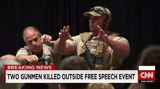 STAR OF THE SHOW: SWAT leader gives safety lecture to the crowd after “gunmen” are killed outside. Click to enlarge