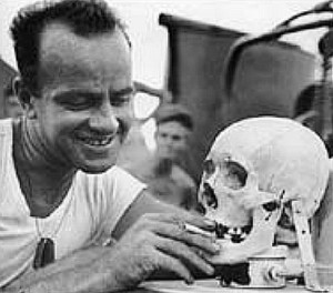AMERICAN MARINE (left) with Japanese skull trophy. (A gift to his girlfriend?)