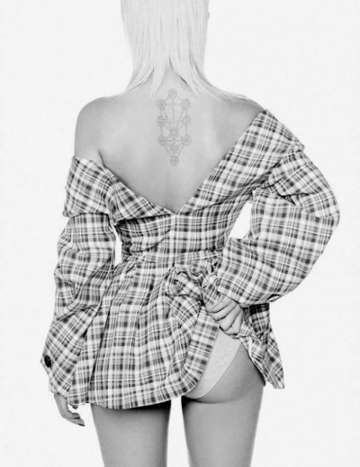 Ora also graced the pages of L’Officiel Russia. Here, she shows us her tattoo of the Kabbalistic Tree of Life (Kabbalah-related tattoos are almost a requisite for Beta Kittens). She also flashes some of her booty because that Kabbalah stuff is not about spirituality – it is a sign of being a slave of the occult elite.