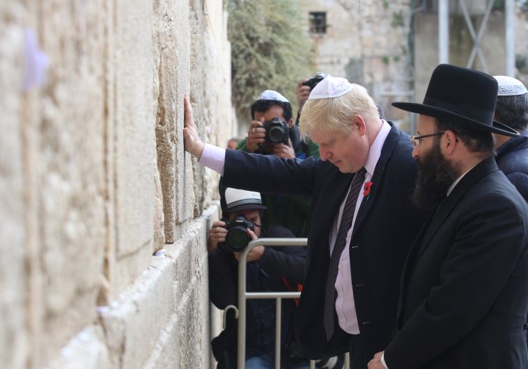 Boris-prays-at-wall