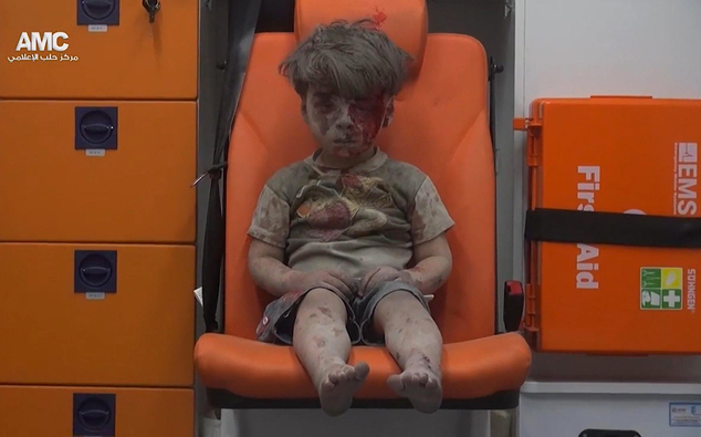 In this frame grab taken from video provided by the Syrian anti-government activist group Aleppo Media Center (AMC), a child sits in an ambulance after being pulled out or a building hit by an airstirke, in Aleppo, Syria, Wednesday, Aug. 17, 2016. Syrian opposition activists reported an airstrikes on the al-Qaterji neighborhood in Aleppo late Wednesday. (Aleppo Media Center via AP)
