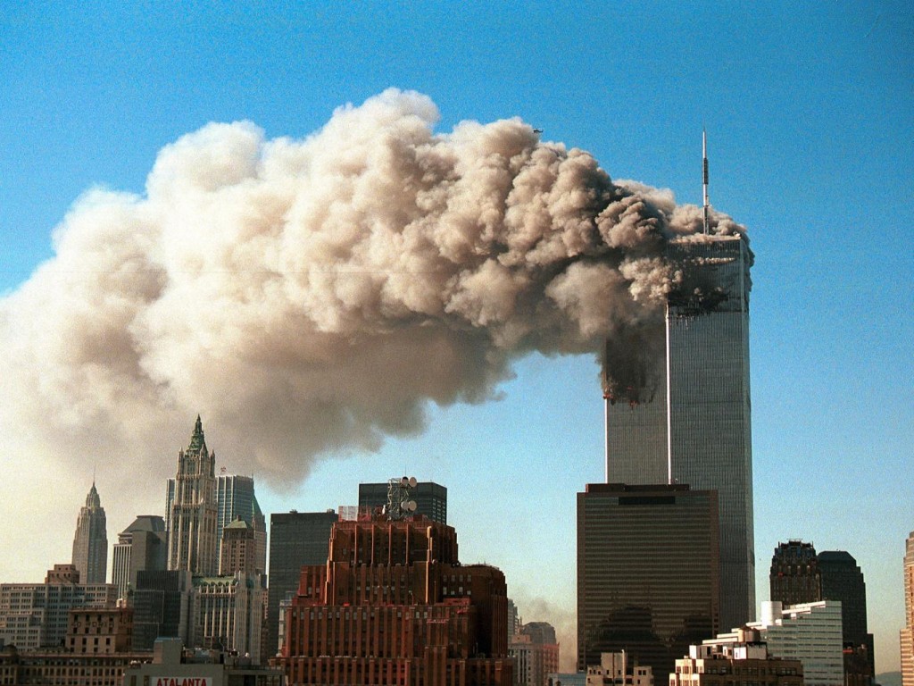 World Trade Center twin towers burn. Click to enlarge