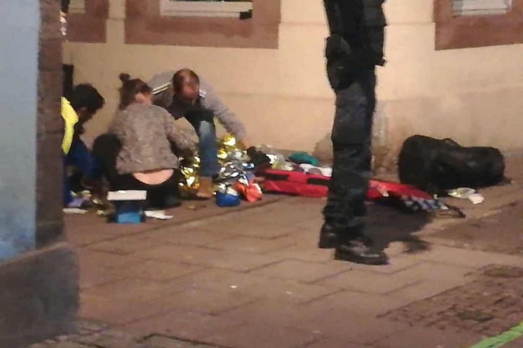 Picture taken with a mobile phone shows rescuers treating an injured person in the streets of Strasbourg. Clcik to enlarge
