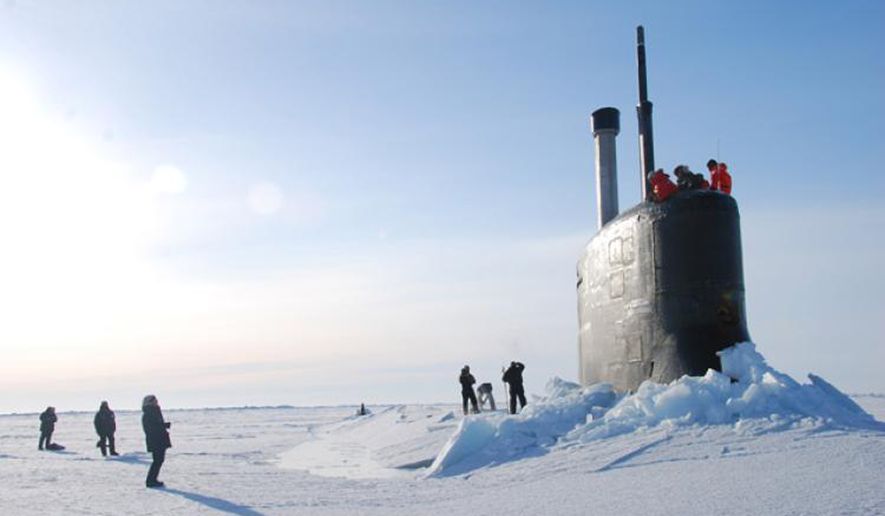 US Navy submarine breaks through the ice in the Beaufort Sea off the coast of North Alaska. Click to enlarge