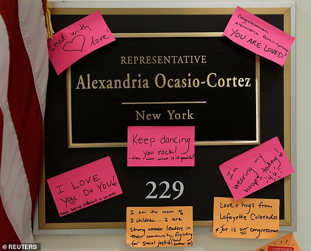 Assorted post-it note messages stuck on the plaque outside Representative Alexandria Ocasio-Cortez’s Capitol Hill office are united in their effusive praise