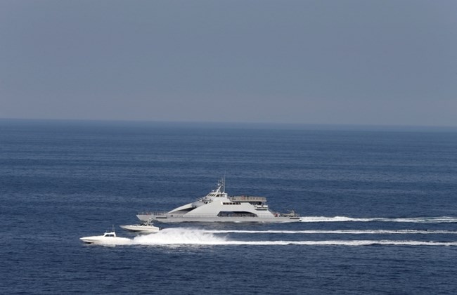 Iranian Revolutionary Guards speed boats are seen near the USS John C. Stennis CVN-74 (not pictured) as it makes its way to gulf through strait of Hormuz, December 21, 2018. Click to enlarge