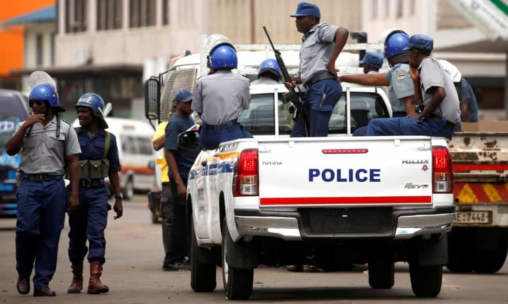 Police patrol the streets of Harare. Click to enlarge