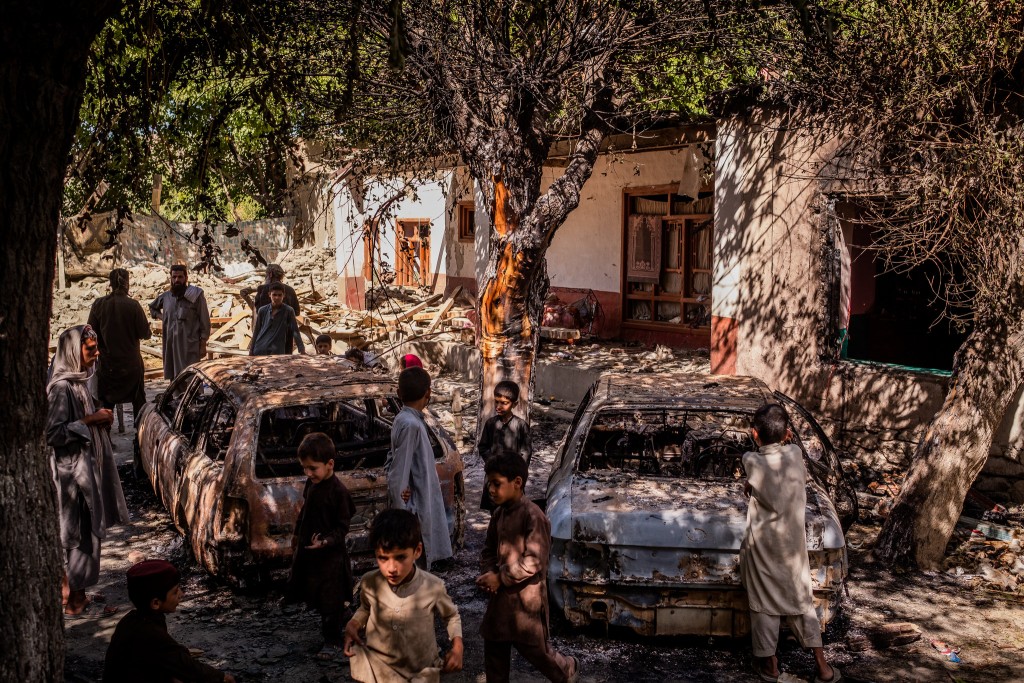 The CIA sponsored forces left behind torched cars and an explosion wrecked house in Khogyani. Click to enlarge