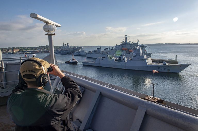 190609-N-AT530-1031 KIEL, GERMANY (June 9, 2019) Personnel Specialist 3rd Class Vadim Strelnikov observes as the Norwegian Fridtjof Nansen-class frigate HNoMS Roald Amundsen (F 311) departs Kiel, Germany for Baltic Operations (BALTOPS) 2019, June 9. BALTOPS is the premier annual maritime-focused exercise in the Baltic Region, designed to enhance flexibility and interoperability among the 18 participating allied and partner nations. (U.S. Navy photo by Mass Communication Specialist 2nd Class Chris Roys/Released)