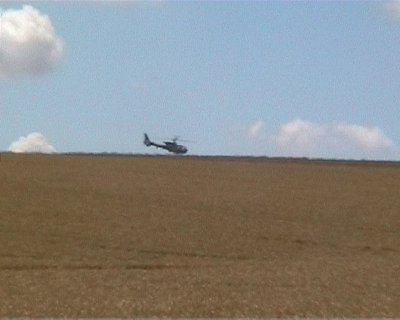 Different black, unmarked helicopters were photographed over the formation on different days.