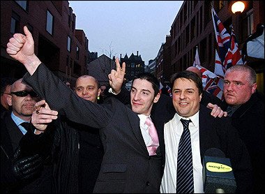 British National Party chairman Nick Griffin (2nd R) and co-accused BNP activist Mark Collett (L) celebrate with party supporters outside Leeds Crown Court in Leeds. Probably completely unaware of what they are helping to bring about.