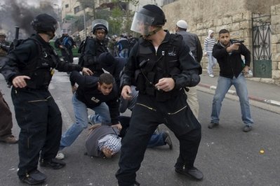 Israeli police subdue a Palestinian protestor