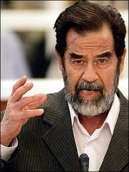 Saddam in the court in the Green Zone yesterday and again, note the dodgy dental work...