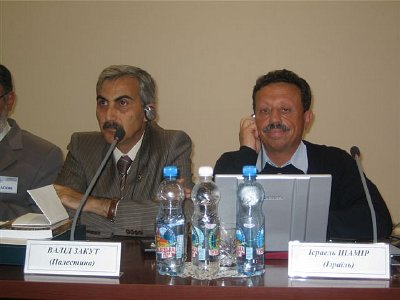 The writer Israel Shamir (seated left), at a recent conference in the Ukraine.