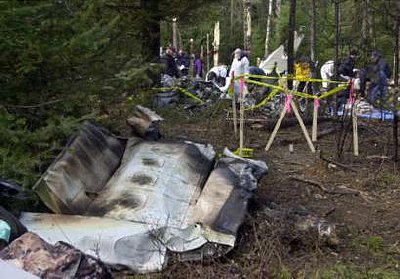 Pictured above: Part of a wing lies nearby as FAA, National Transportation and Safety Board investigators and FBI agents sift through the wreckage of a small plane crash that killed U.S. Senator Paul Wellstone and seven others about two miles south of the Eveleth Municipal Airport near Eveleth, Minnesota, October 27, 2002. The plane crashed October 25. REUTERS/Pool/Jim Mone